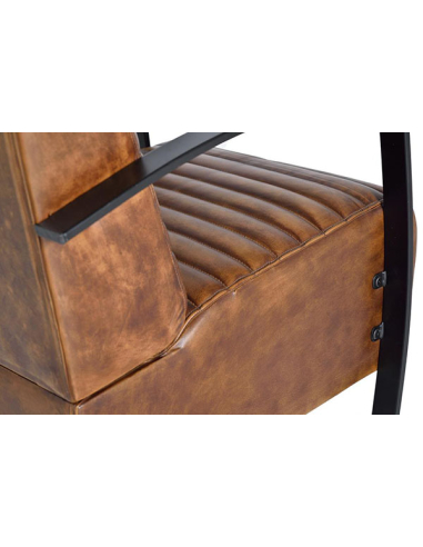 Sillón tapizado en piel de vacuno