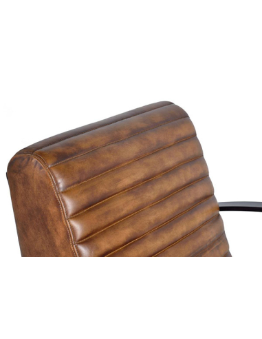 Sillón tapizado en piel de vacuno
