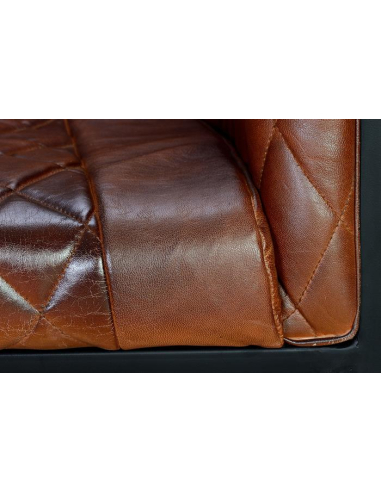 Butaca tapizada en piel con...