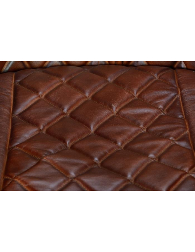 Butaca tapizada en piel con...